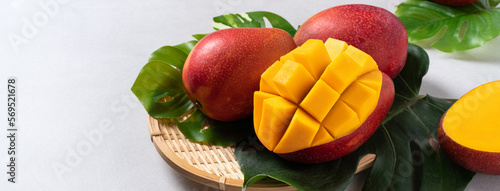 Obraz na płótnie Mango background design concept. Diced fresh mango fruit on white table.