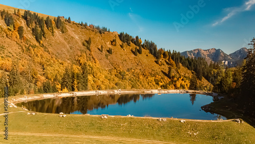 Beautiful alpine autumn or indian summer landscape shot with reflections in a pond at the famous Loferer Alm, Lofer, Salzburg, Austria