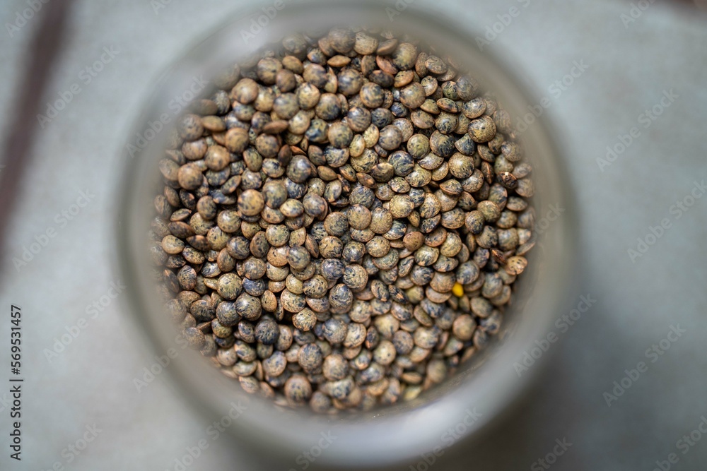 dried fruit, dates, prunes, grains, wheat, lentils, rice stored in glass jars in a kitchen