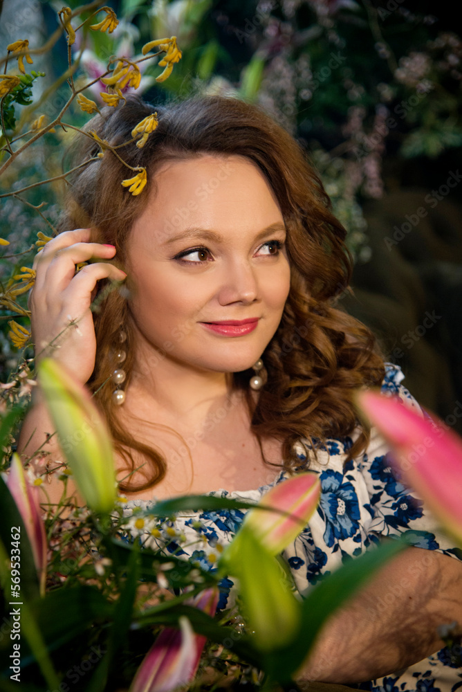 portrait of beautiful brunette smiling romantic woman in dress with blue flowers in vintage room with flowers portrait of beautiful brunette smiling romantic woman in dress with blue flowers in vintage room with flowers