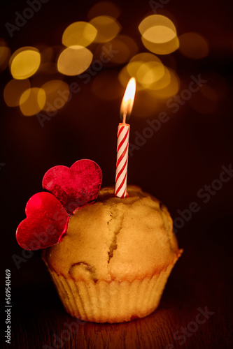 cake with burning candles and hearts