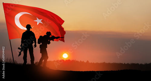Silhouettes of soldiers with Turkey flag on background of sunset. Concept of crisis of war and political conflicts between nations. Greeting card for Turkish Armed Forces Day, Victory Day.