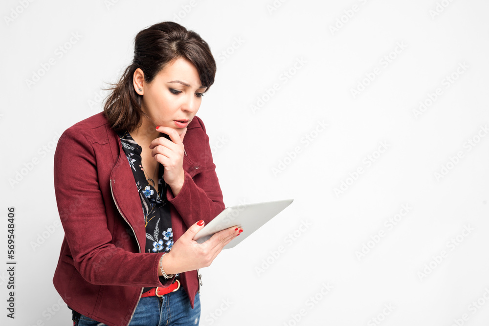hispanic woman, company worker holding digital tablet, standing over white background hispanic woman, company worker holding digital tablet, standing over white background