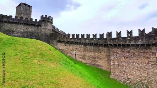 Outer ward of Montebello Castle and Bellinzona in valley, Switzerland photo