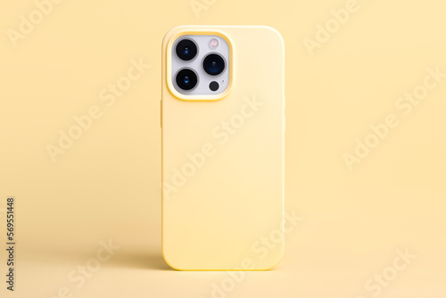 yellow banana color phone case mockup. iPhone 13 and 14 Pro Max mock up back view isolated on yellow background