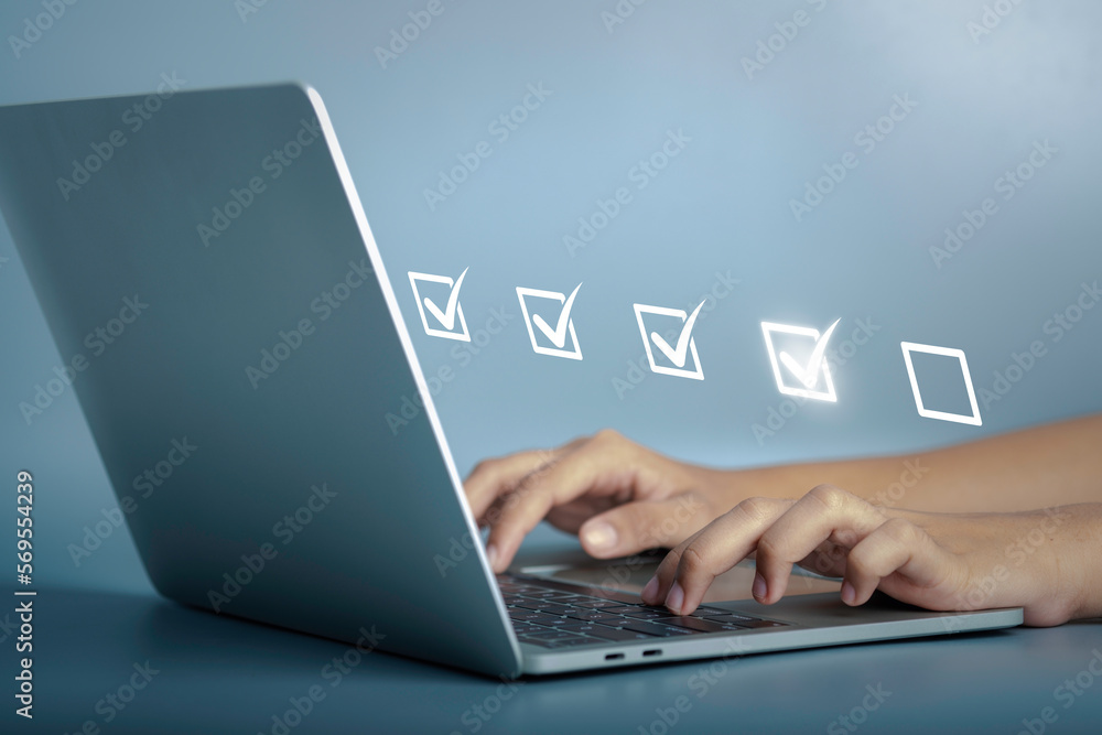 Digital work checklist or electronic smart daily checklist concept. Check mark on virtual screen display for personal working in office Document Management System and process automation. Digital work checklist or electronic smart daily checklist concept. Check mark on virtual screen display for personal working in office Document Management System and process automation.