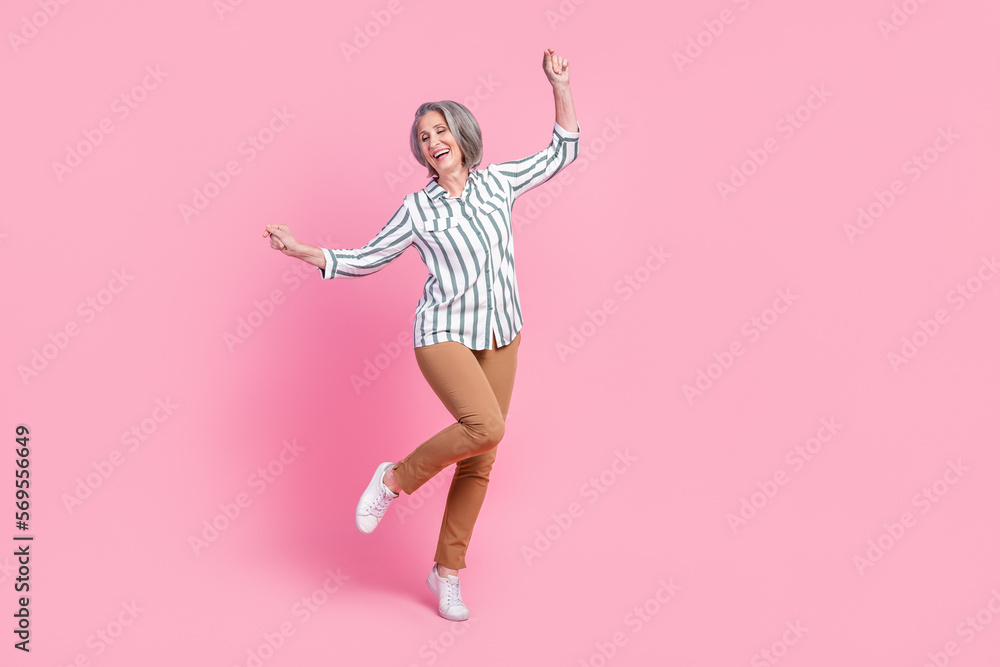 Full length photo of shiny adorable woman dressed smart casual outfit having fun empty space isolated pink color background