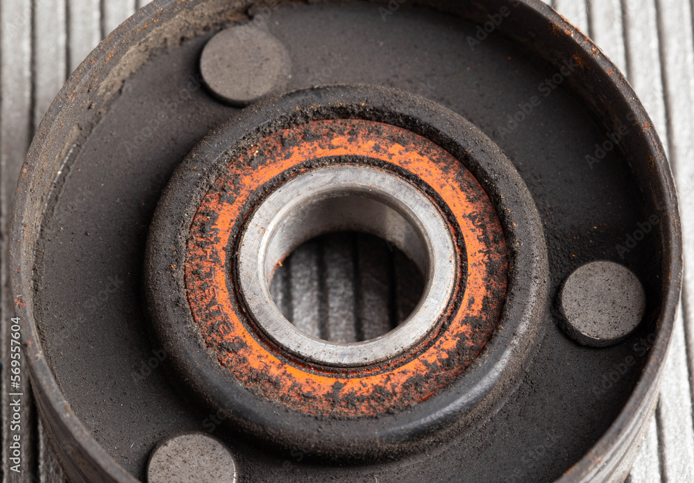 Old bypass car roller. Roller jamming, close-up Old bypass car roller. Roller jamming, close-up