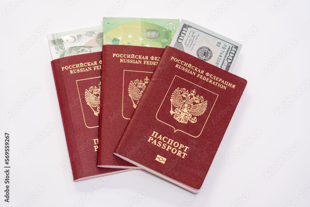 As far as Russian passports with piles of various world currencies nested in them as a symbol of freedom of travel As far as Russian passports with piles of various world currencies nested in them as a symbol of freedom of travel