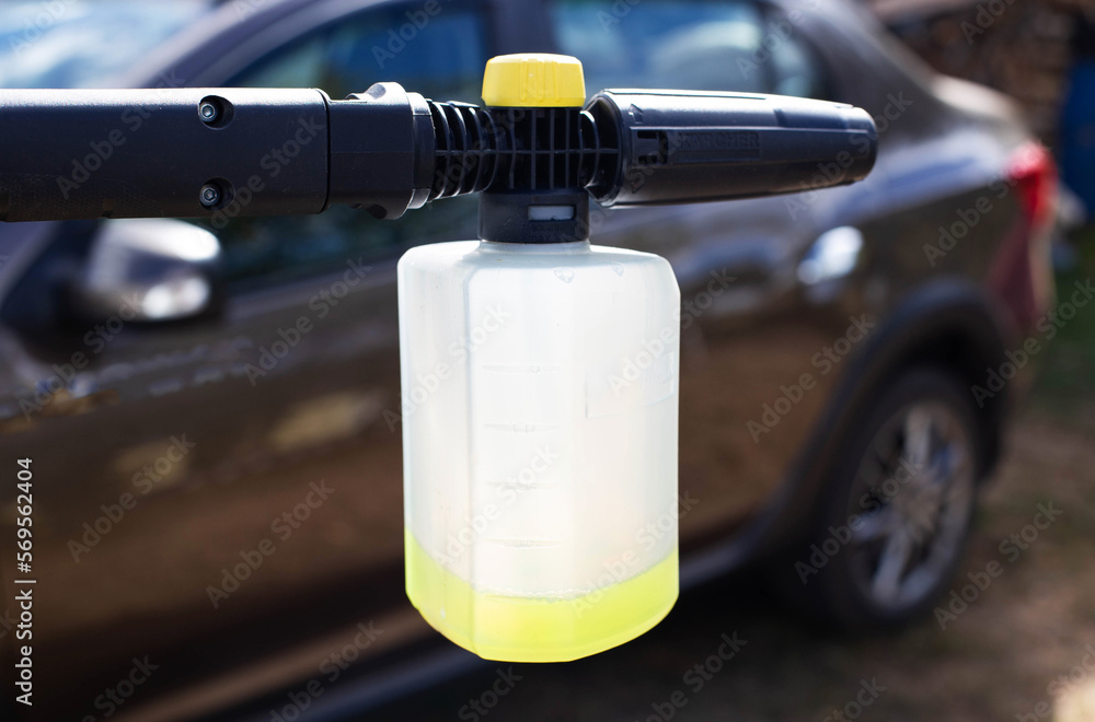 High pressure washer with foam nozzle for cleaning the car with foam. Modern concentrated shampoo. High pressure washer with foam nozzle for cleaning the car with foam. Modern concentrated shampoo.