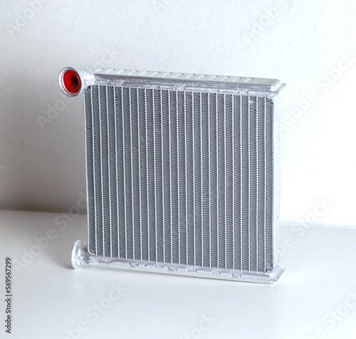 Aluminum radiator of a car stove on a white background, close-up, isolated photo