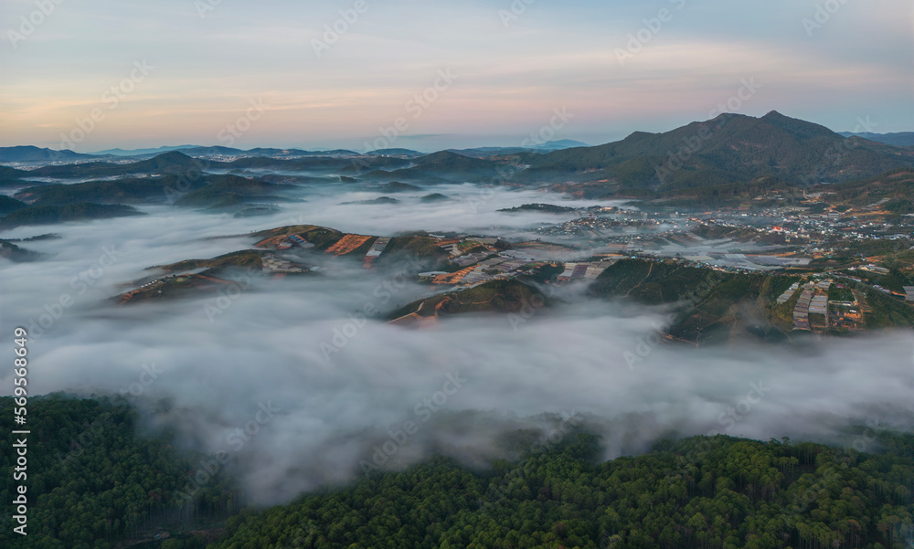 Ariel view of mountain village in mist