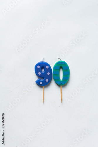 top view of number candles, number 90 candle on a white background, birthday candles on white background