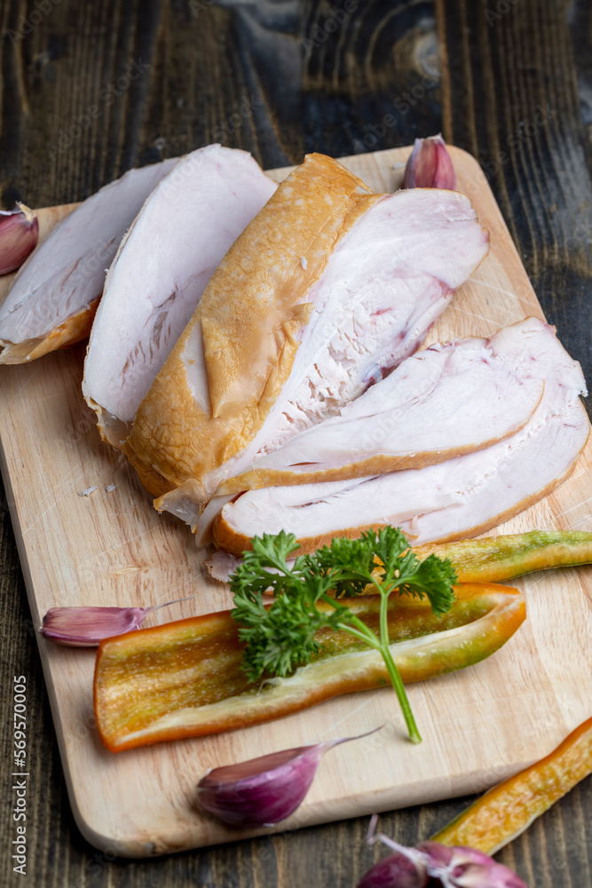 Smoke-smoked chicken is cut up on a board Smoke-smoked chicken is cut up on a board