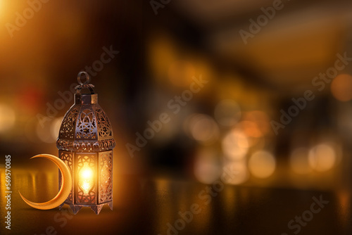 Valokuva Ornamental Arabic lantern with burning candle glowing