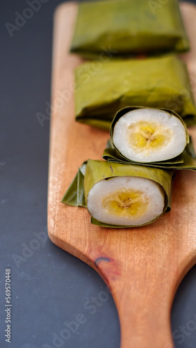 Nogosari is Javanese traditional food made from rice flour and coconut milk put a banana inside and steamed, wrapped in banana leaf. photo