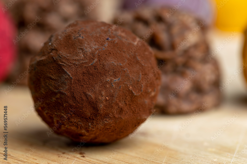 Chocolate sweet candy in the shape of a ball on the table Chocolate sweet candy in the shape of a ball on the table