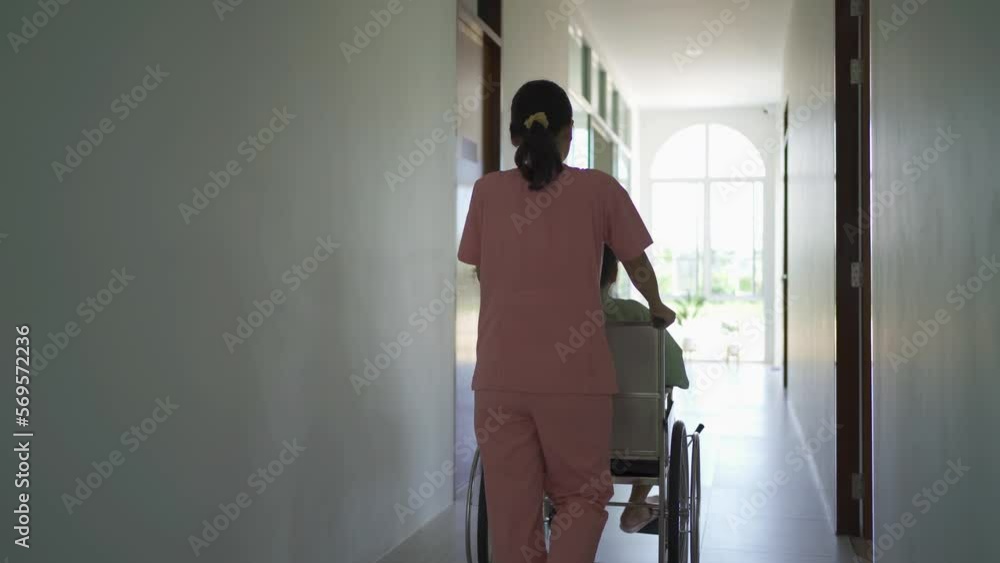Old elderly disabled Asian patient or pensioner and a nurse using wheelchair to practice to walk in nursing home in hospital. Senior people lifestyle activity recreation. Health care physical therapy Old elderly disabled Asian patient or pensioner and a nurse using wheelchair to practice to walk in nursing home in hospital. Senior people lifestyle activity recreation. Health care physical therapy