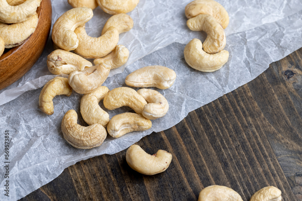 Fototapeta premium Fresh peeled cashew nuts on the table