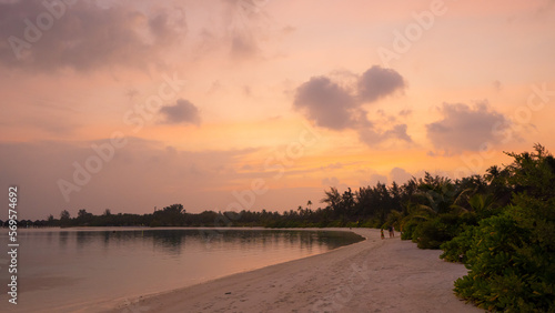 Sunset on the beach. Paradise beach. Tropical paradise  white sand  beach  palm trees and clear water.