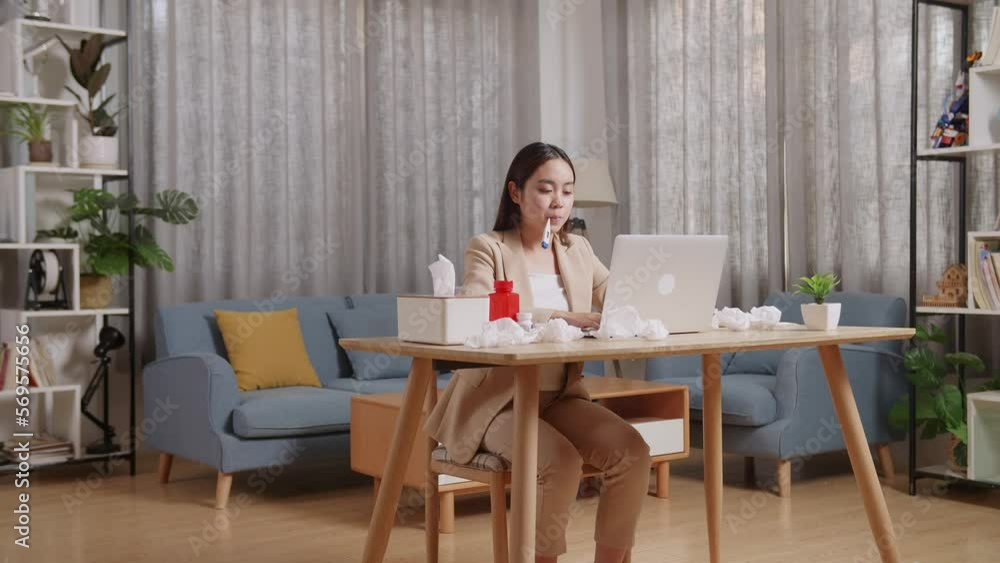 Sick Asian Businesswoman Using Thermometer Test For Flu, Cold And Body Temperature While Working With Laptop In The Living Room At Home
Sick Asian Businesswoman Using Thermometer Test For Flu, Cold And Body Temperature While Working With Laptop In The Living Room At Home