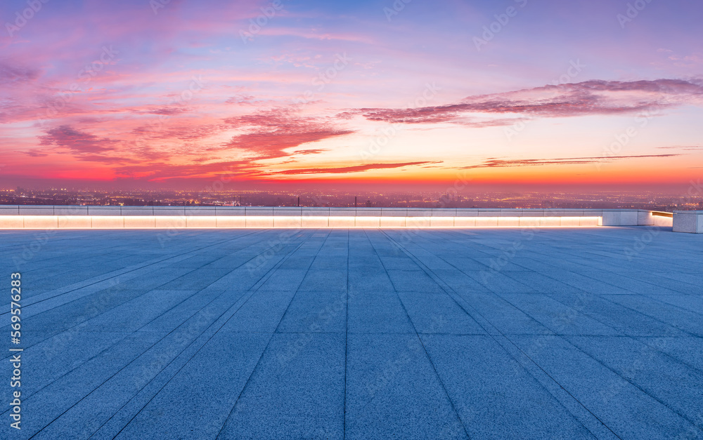 Empty square floor and city skyline with sky clouds at sunrise in Shanghai, China.