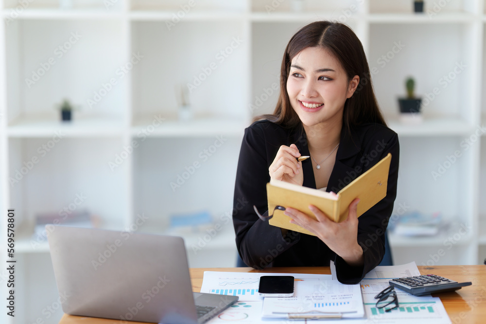 Asian Business woman working at home office and analyze financial report document. Accounting and Finance concept
