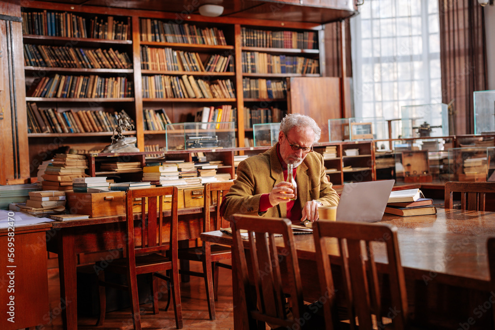 College professor in library. College professor in library.