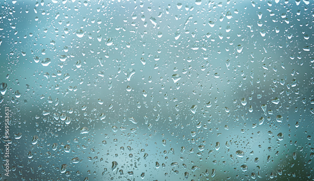 Raindrops on the window. Abstract blue background Raindrops on the window. Abstract blue background