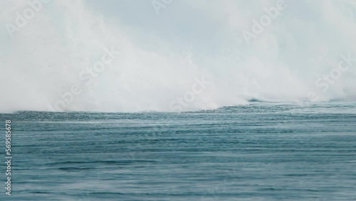 Surfer rides big wave and gets barrelled. Real speed version (check slow motion and speed warp versions too). Surfer on a big wave in the Maldives goes into barrel and disappears