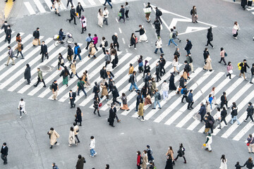 Crowded Japanese people, Asian traveler walk cross road at Shibuya scramble crossing. Tokyo tourist attraction, Japan tourism, Asia transport, commuter transportation or city life concept