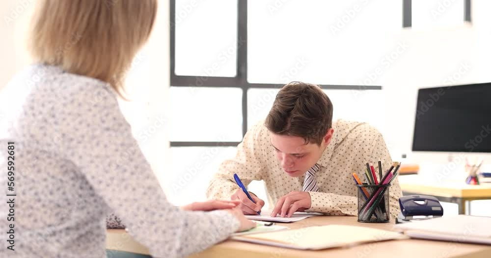 Manager gives contract to specialist for signing in office Manager gives contract to specialist for signing in office