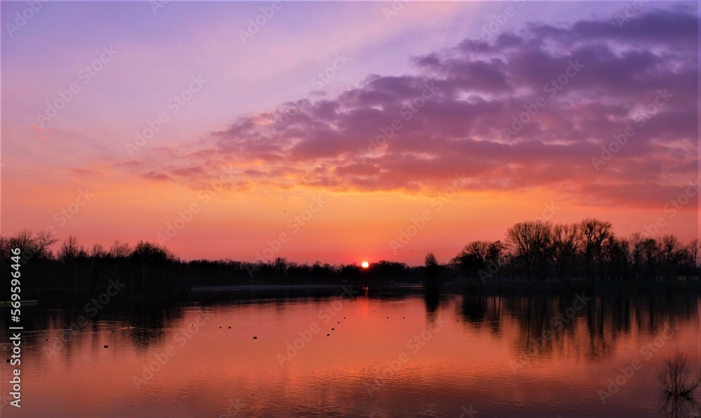 Beautiful purple sunset on the lake