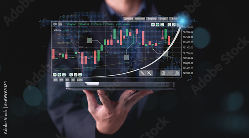 Stock investment Businessman finance analyst calculating and analyzing financial data with economic graph growth chart  stock market report  finance  banking and investment  business plan.  