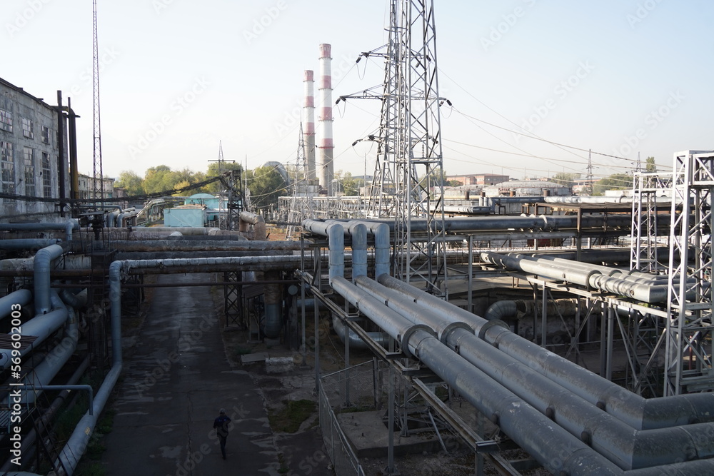 Almaty, Kazakhstan - 10.07.2022 : Large pipes on the territory of the heating plant and electrical substation.
