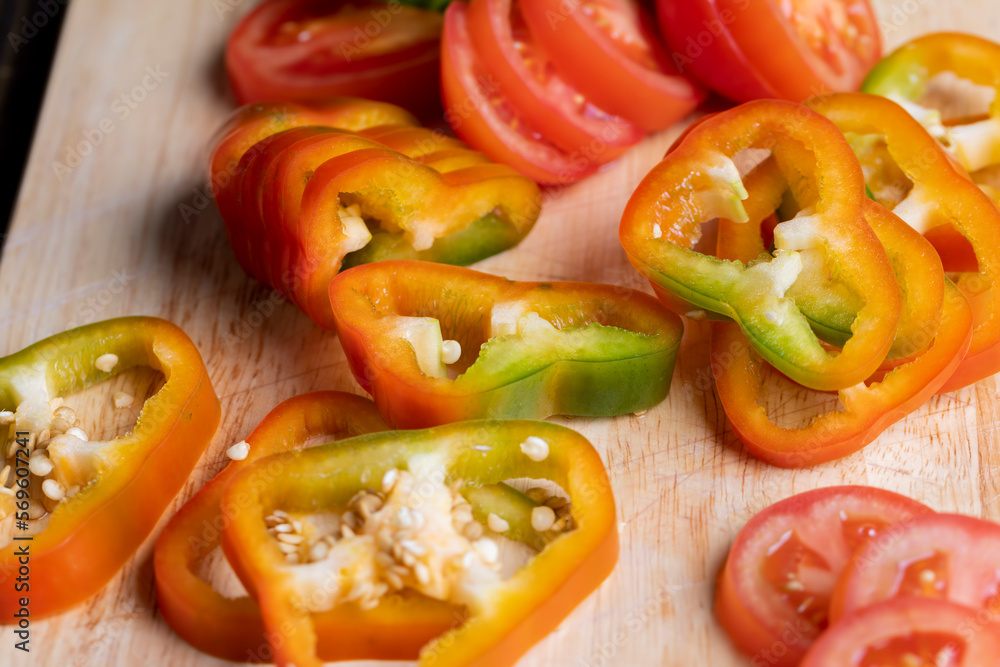 Fresh ripe bell pepper sliced on a board Fresh ripe bell pepper sliced on a board