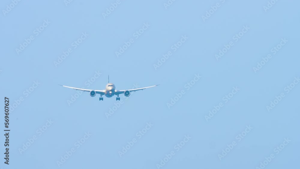 Jet plane approaching landing, long shot front view. Tourism travel concept Jet plane approaching landing, long shot front view. Tourism travel concept