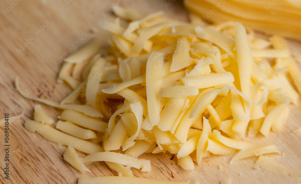 Sliced and grated hard cheese with cashew nuts Sliced and grated hard cheese with cashew nuts