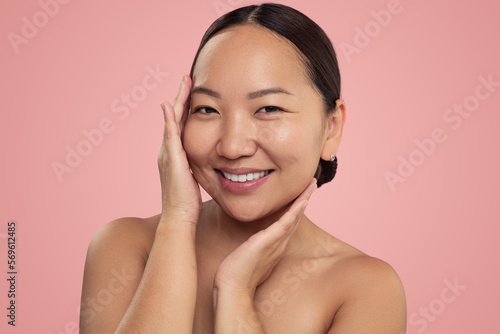 Asian woman enjoying skin softness
