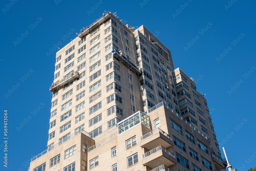 Apartment Building. A row of new townhouses or condominiums. Street view of an eco-friendly block of flats in the green park.
Apartment Building. A row of new townhouses or condominiums. Street view of an eco-friendly block of flats in the green park.