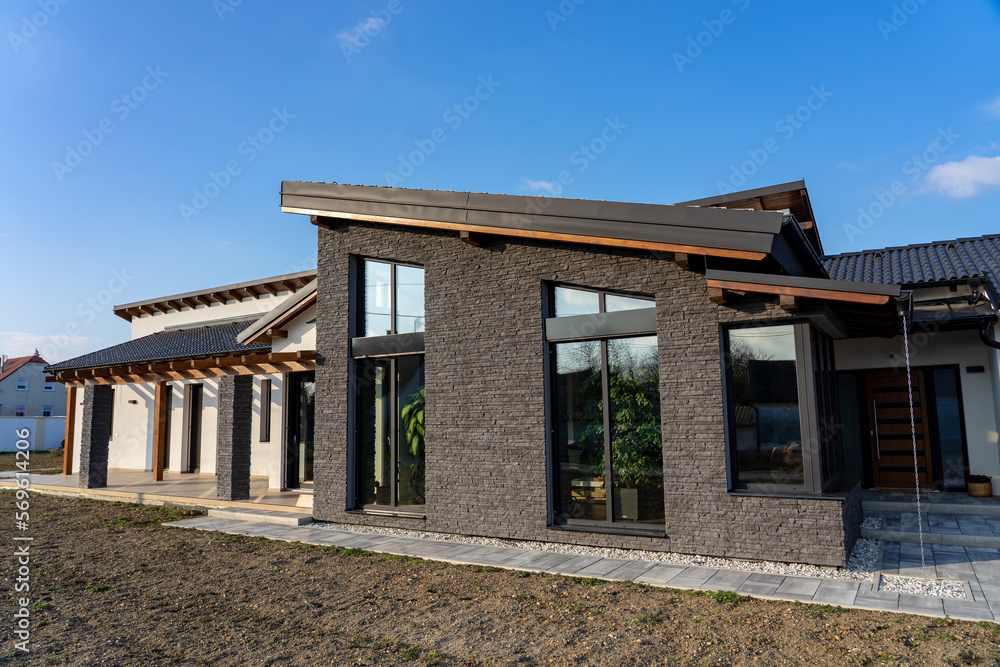 modern home house with nature vibe wooden rocky details and plants and big windows modern home house with nature vibe wooden rocky details and plants and big windows