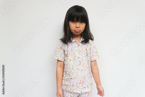Bilde på lerret Upset black-haired fringe hairstyle small girl pucker up her mouth feel upset or