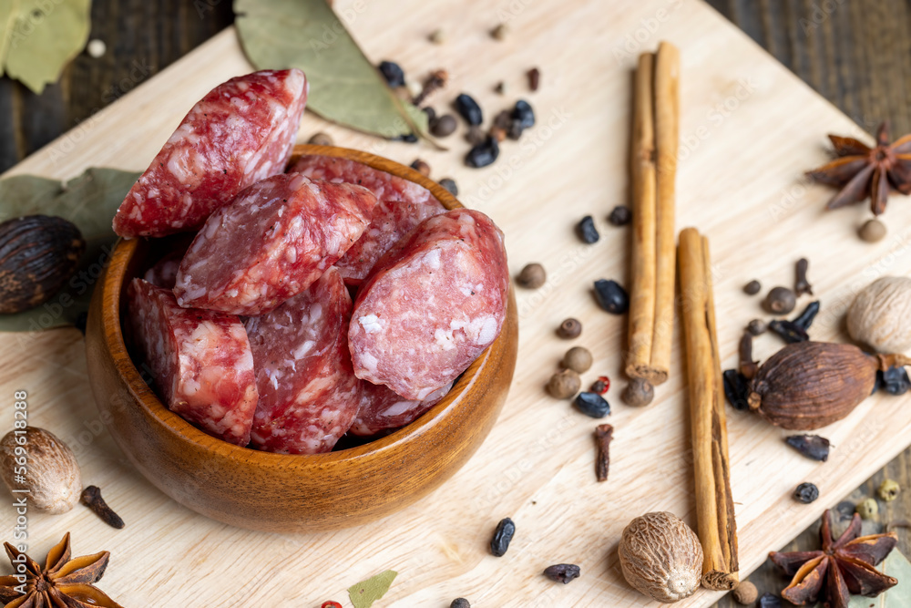 Dried veal sausage during slicing Dried veal sausage during slicing
