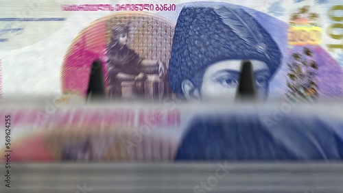 Georgia money Georgian Lari money counting machine with banknotes. Quick 100 GEL currency note down rotation. Business and economy. Concept loopable and seamless background.