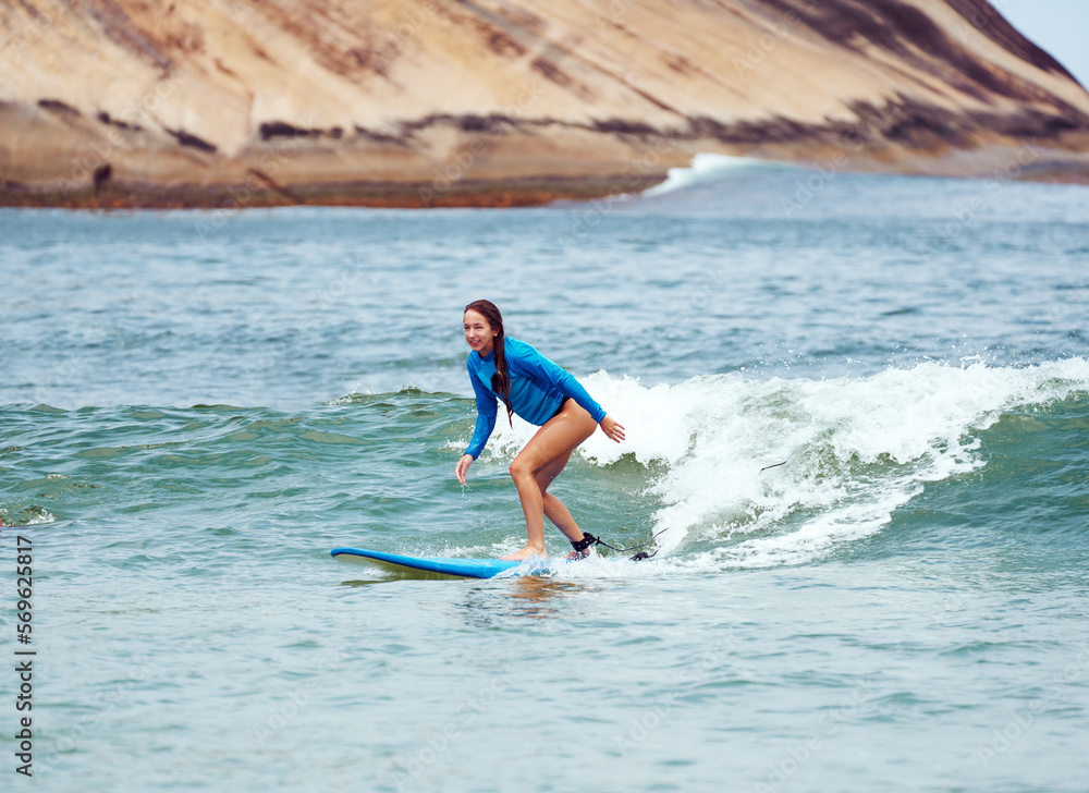 young caucasian brazilian woman beginner surfer surfing the waves in Brazil young caucasian brazilian woman beginner surfer surfing the waves in Brazil