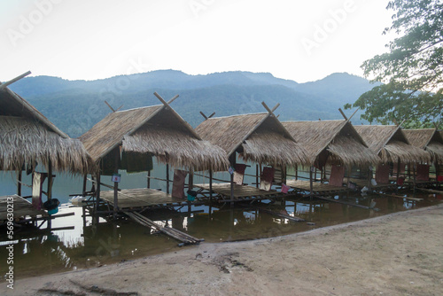 Straw floating huts on the water at Huay Tueng Thao Reservoir in Chiang Mai, Thailand. © Danica Chang