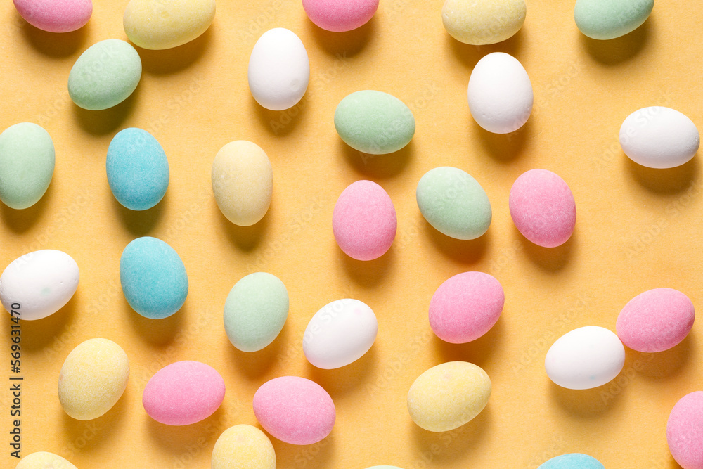 Pile of sweets on yellow background, top view Pile of sweets on yellow background, top view