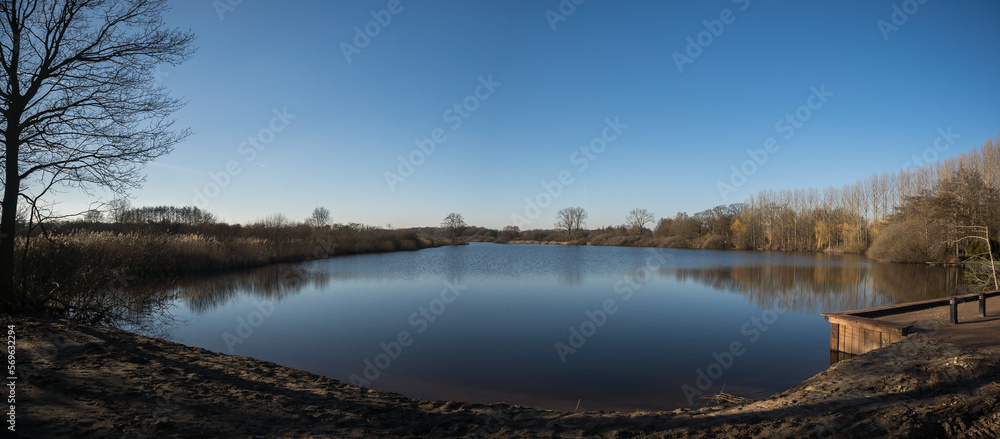 Panorama of lake 'Wijchense Ven', a natural reserve area in Wijchen, the Netherlands on a sunny day in February