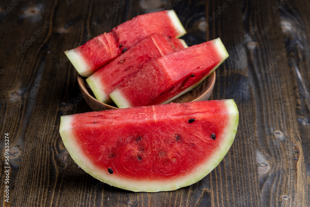 Sliced red and ripe watermelon on the table