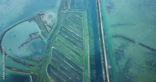Aquatory of amazing Venetian lagoon with anti-flooding barrier system and calm azure water at summer twilight aerial panorama photo
